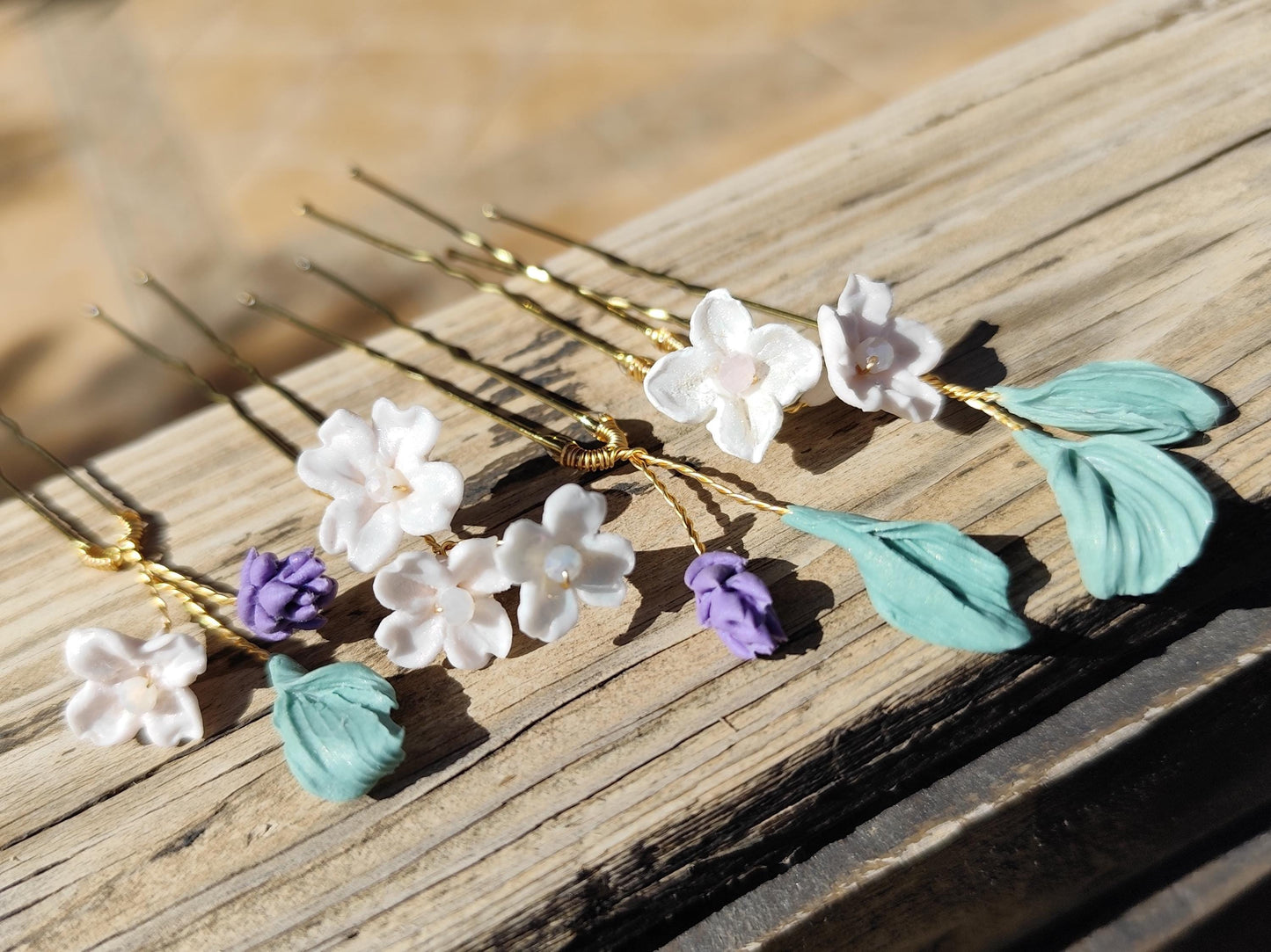 Conjunto de 5 horquillas con flores y hojas